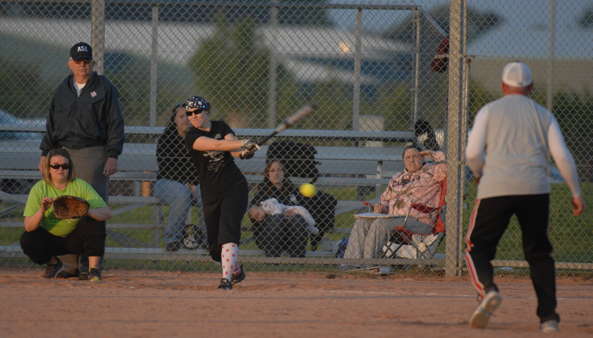 Center, Staff Sgt. Tabitha Lee, 100th Air Refueling Wing Public Affairs NCO in charge of Visual Information, bats during an intramural softball game between the 100th Communication Squadron and the 100th Civil Engineer Squadron May 22, 2013, at RAF Mildenhall, England. The softball season will run through mid-July. (U.S. Air Force photo by Airman 1st Class Dillon Johnston/Released)