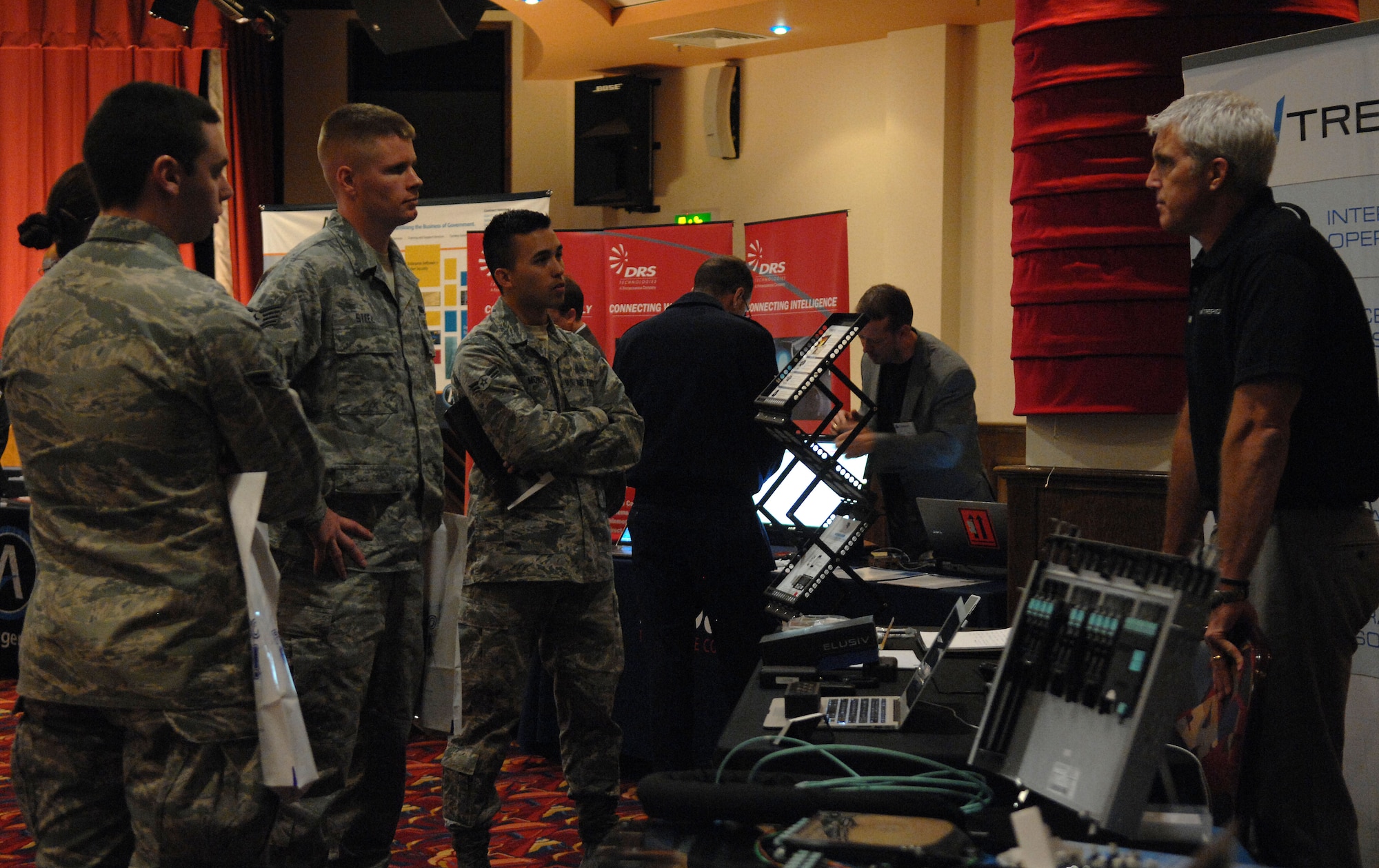 Team Mildenhall Airmen view exhibits at a Technology Expo hosted by the 100th Communications Squadron, May 23, 2013, at the Galaxy Club on RAF Mildenhall, England. The free Technology Expo had more than 25 different exhibits. (U.S. Air Force photo by Airman 1st Class Dillon Johnston/Released)
