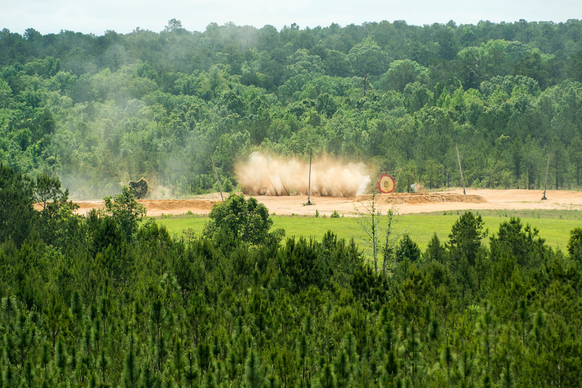 Dirt flies from the impact of a burst of 30 millimeter bullets fired from the gun of an A-10 Thunderbolt II, May 22, 2013, Claiborne Bombing and Gunnery Range, Kisatchie National Forest, La. The range is primarily used by A-10s from the 917th Fighter Group at Barksdale Air Force Base, La., but with the FG scheduled to be inactivated in September 2013, this marked the last "live fire" sorties over the range. (U.S. Air Force photo by Master Sgt. Greg Steele/Released)