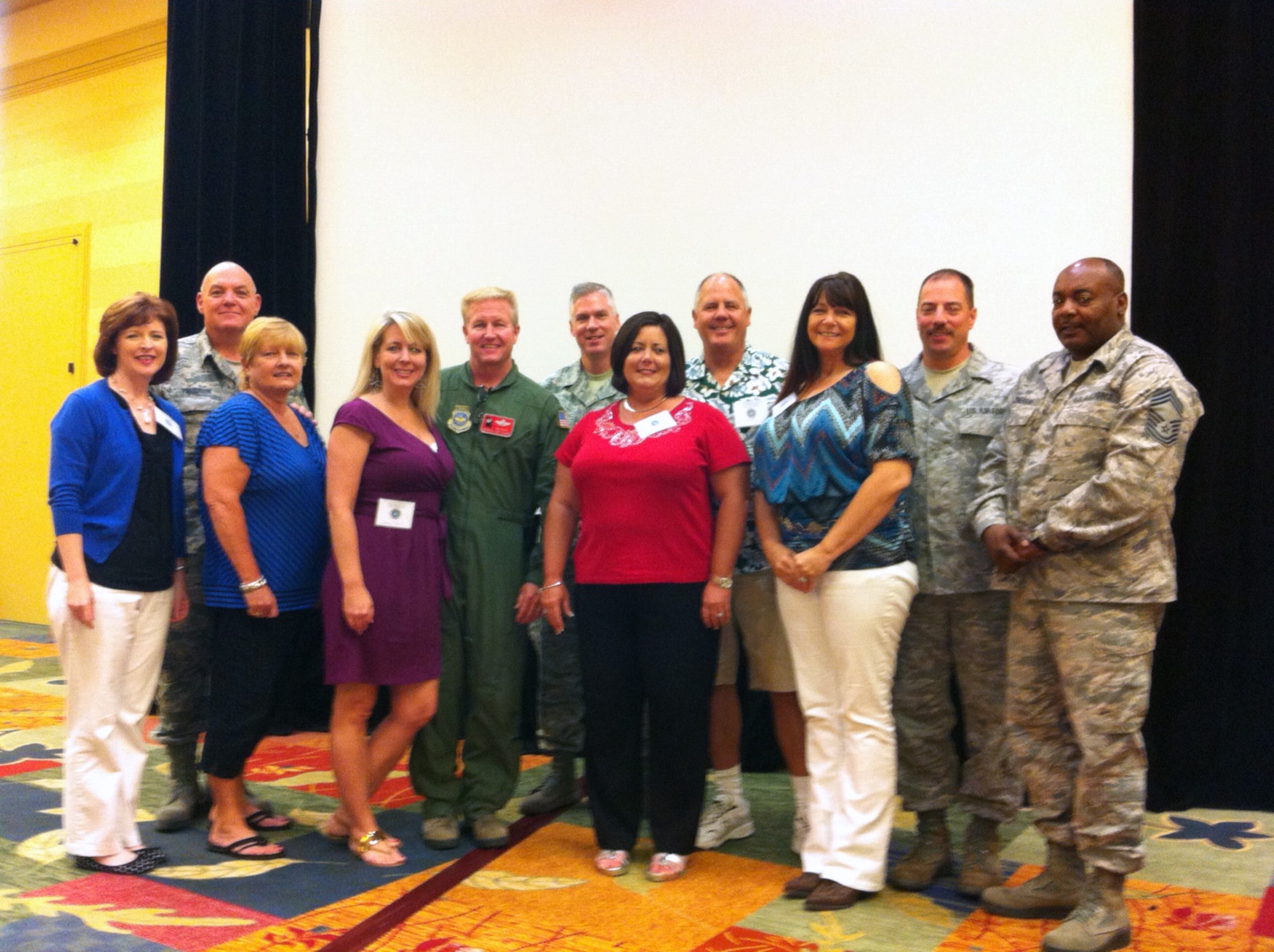 165th Airlift Wing Key Spouses Mrs. Judi Lenz and Mrs. Stacy Roberts receive awards at the 2013 Georgia National Guard Family Readiness Conference. Mrs. Lenz (3rd from right) won Volunteer of the Year (Air) for the state of Georgia and Mrs. Stacey Roberts (5th from right) received the Key Spouse Outstanding Service Award. (photo donated)