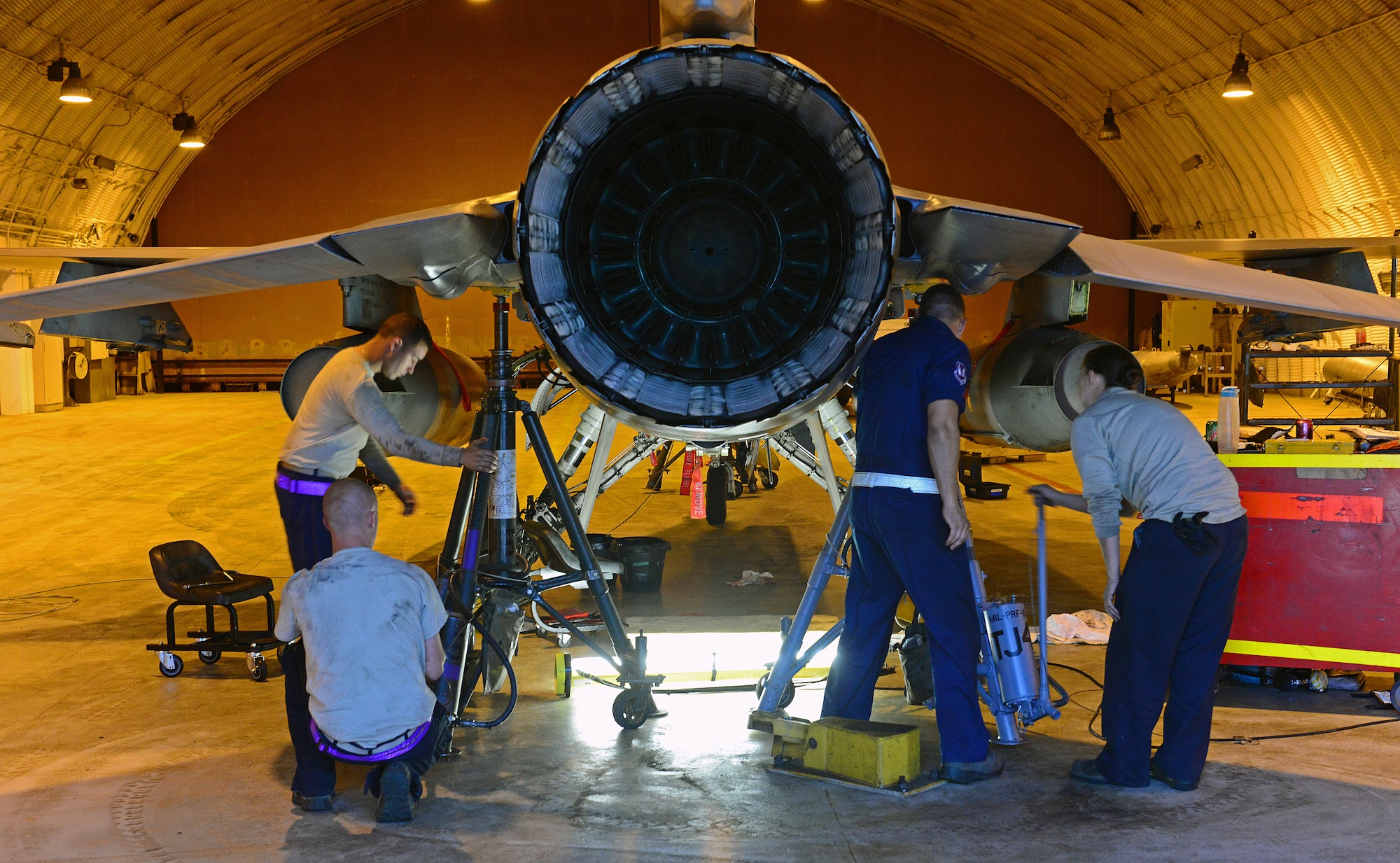 Dedicated crew chiefs from the 510th Aircraft Maintenance Unit use jack stands to raise an F-16 Fighting Falcon May 14, 2013, at Aviano Air Base, Italy. The 510th AMU is part of the 31st Aircraft Maintenance Squadron, which is responsible for maintaining 31st Fighter Wing aircraft to support U.S. Air Forces in Europe and NATO operations. (U.S. Air Force photo/Airman 1st Class Matthew Lotz)