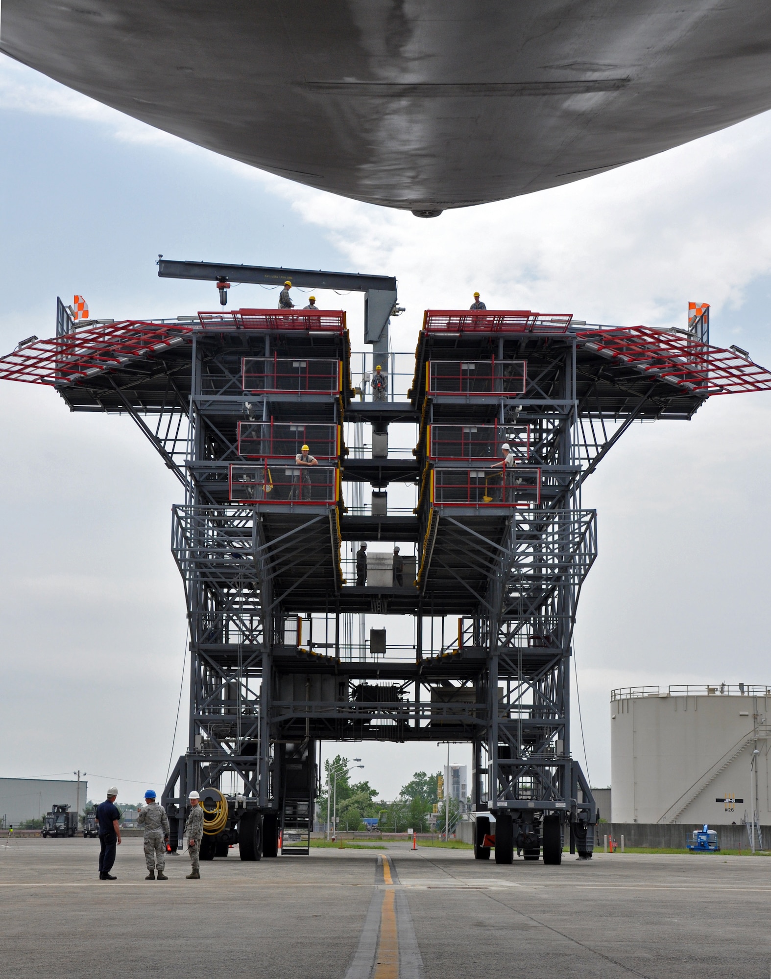 Troops from the 439th Maintenance Squadron prepare to tow a C-5 Galaxy into Westover's Regional Isochronal dock, May 22, 2013, to test the newly-constructed mobile tail enclosure. Crews broke ground April 1, 2012, for the $5 million MTE, is a moveable structure on rails that will protect maintenance troops from harsh New England weather. The MTE is the largest structure of its kind in the Air Force. (U.S. Air Force photo/SrA Kelly Galloway)