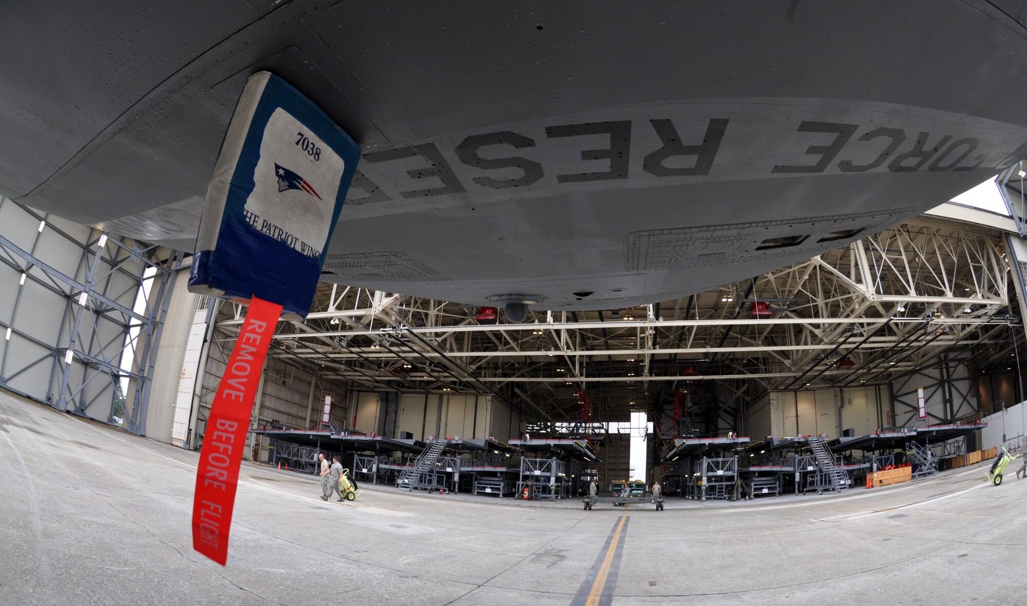 Troops from the 439th Maintenance Squadron prepare to tow a C-5 Galaxy into Westover's Regional Isochronal dock, May 22, 2013, to test the newly-constructed mobile tail enclosure. Crews broke ground April 1, 2012, for the $5 million MTE, is a moveable structure on rails that will protect maintenance troops from harsh New England weather. The MTE is the largest structure of its kind in the Air Force. (U.S. Air Force photo/SrA Kelly Galloway)