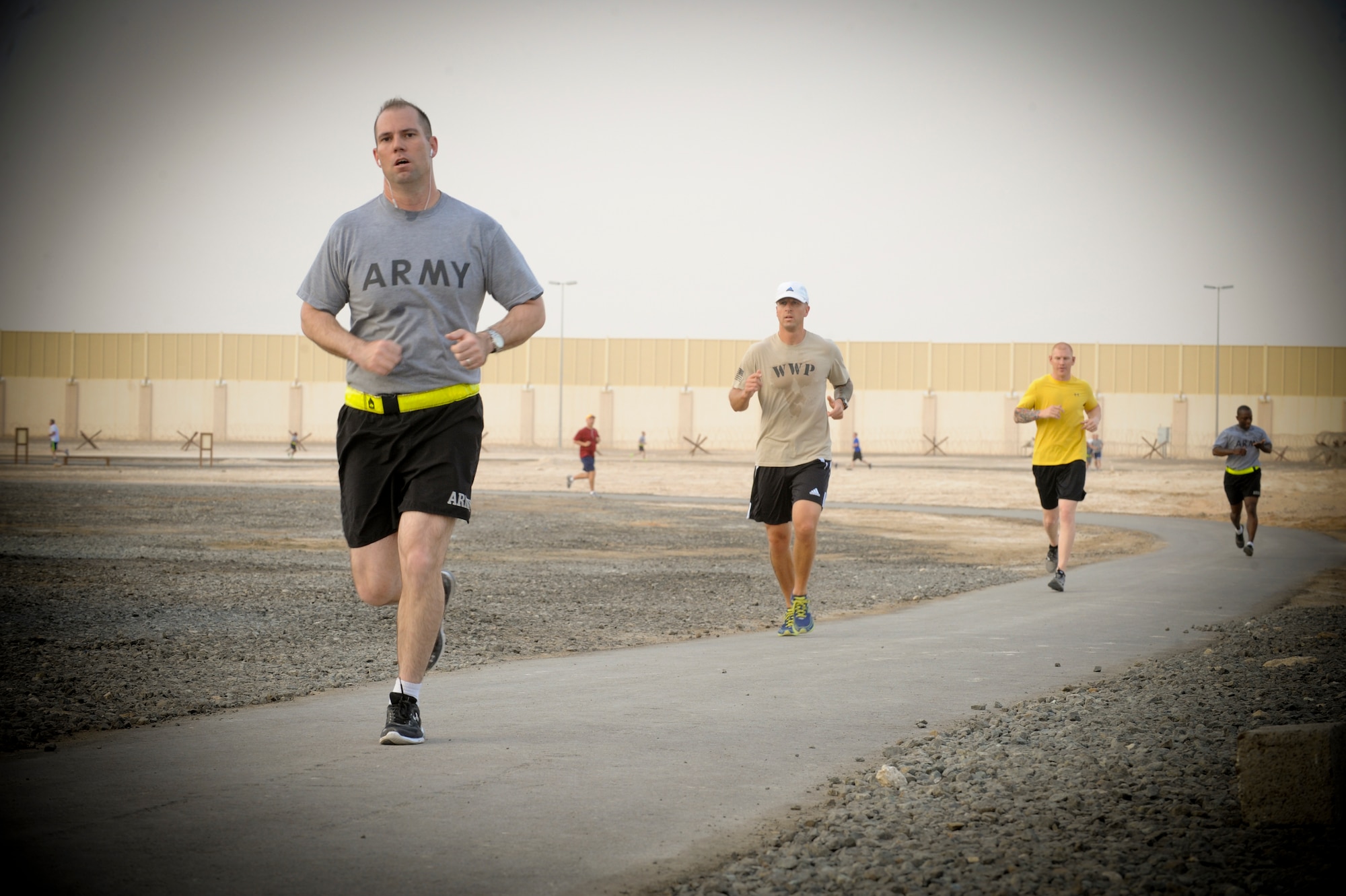 Runners participating in the Bolder Boulder 10K run continue down the designated route, May 23, 2013, at an undisclosed location in Southwest Asia. The Bolder Boulder 10K is an annual race held in Boulder, Colo. on Memorial Day. Members from the United States Air Force, United States Army and civilian contractors participated in the race. (U.S. Air Force photo by Staff. Sgt Joshua J. Garcia)