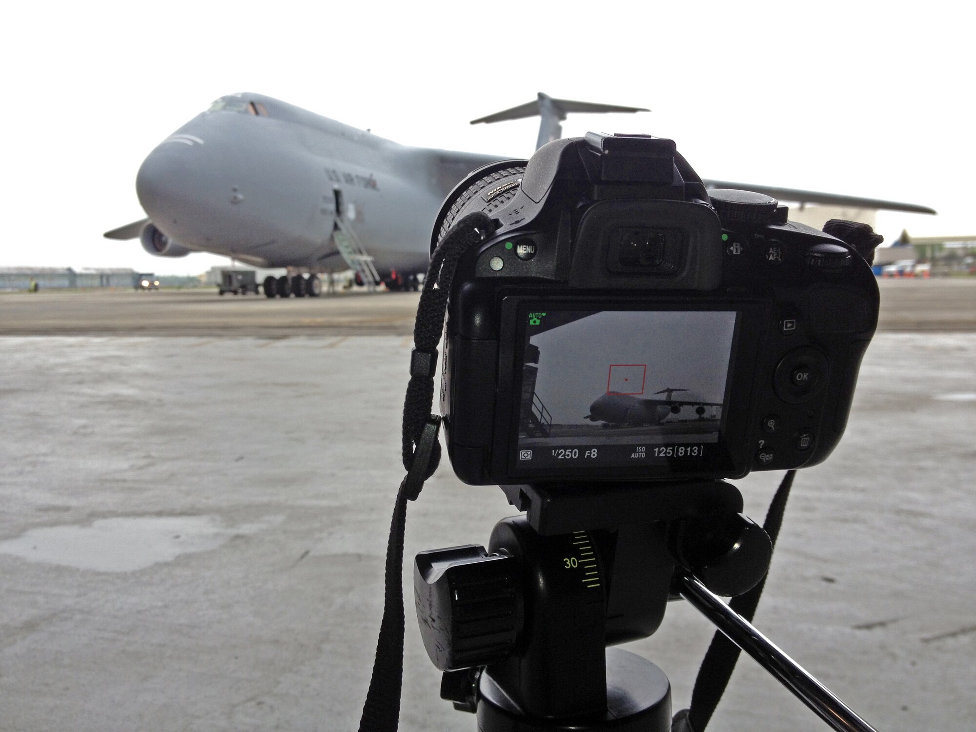 Troops from the 439th Maintenance Squadron prepare to tow a C-5 Galaxy into Westover's Regional Isochronal dock, May 22, 2013, to test the newly-constructed mobile tail enclosure. Crews broke ground April 1, 2012, for the $5 million MTE, is a moveable structure on rails that will protect maintenance troops from harsh New England weather. The MTE is the largest structure of its kind in the Air Force. (U.S. Air Force photo/SrA Kelly Galloway)