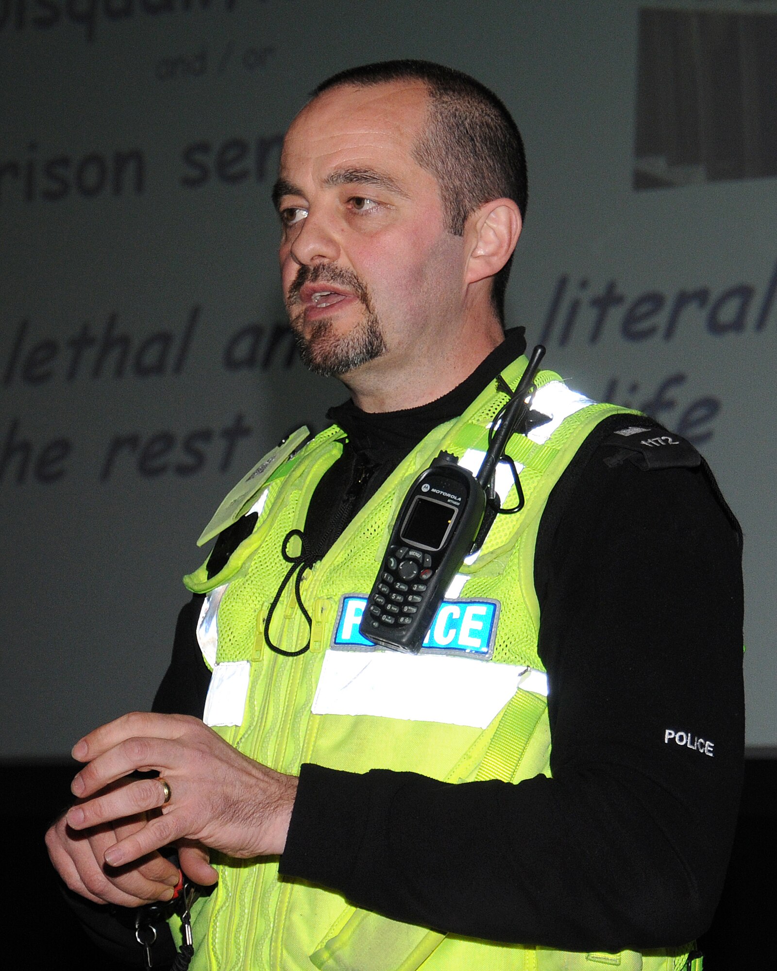 Police Constable Kevin Stark from Suffolk Police discusses the dangers of driving while under the influence of alcohol or drugs during a 101 Critical Days of Summer Drive Wise presentation May 23, 2013, at the base theater on RAF Mildenhall, England. The demonstration concluded with a video showing a family who lost their son to reckless driving. The young man was killed while racing his friend in his car. The video showed the devastation left behind for the victim’s family. (U.S. Air Force photo by Gina Randall/Released)
