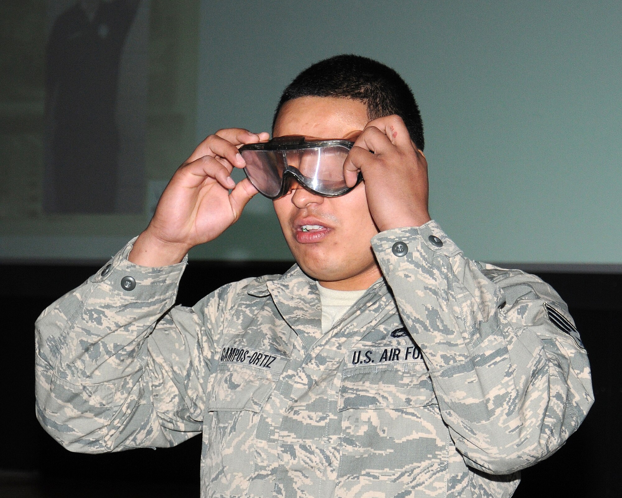 A Team Mildenhall Airman uses special glasses to understand how the affects of alcohol or drugs impair a person’s vision and balance during a 101 Critical Days of Summer Drive Wise presentation May 23, 2013, at the base theater on RAF Mildenhall, England. The presentation was aimed at Airmen under 26 years old to show them the consequences of driving dangerously or under the influence of alcohol or drugs. (U.S. Air Force photo by Gina Randall/Released)
