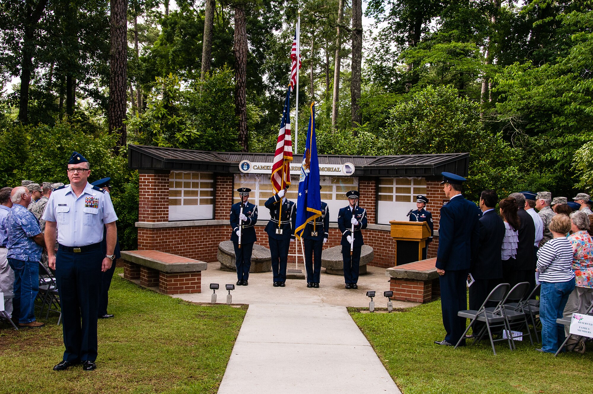 Maj. Robert Hagen, serving as the formation commander, calls the Air Force, Army and Marine units to order May 23, 2013, on Robins Air Force Base, Ga. Members from Team Robins gathered at Camellia Gardens Memorial for a service honoring those who served the Robins AFB community and are no longer with us. This year, 59 names were added to the memorial. (U.S. Air Force photo/Staff Sgt. Alexi Saltekoff)