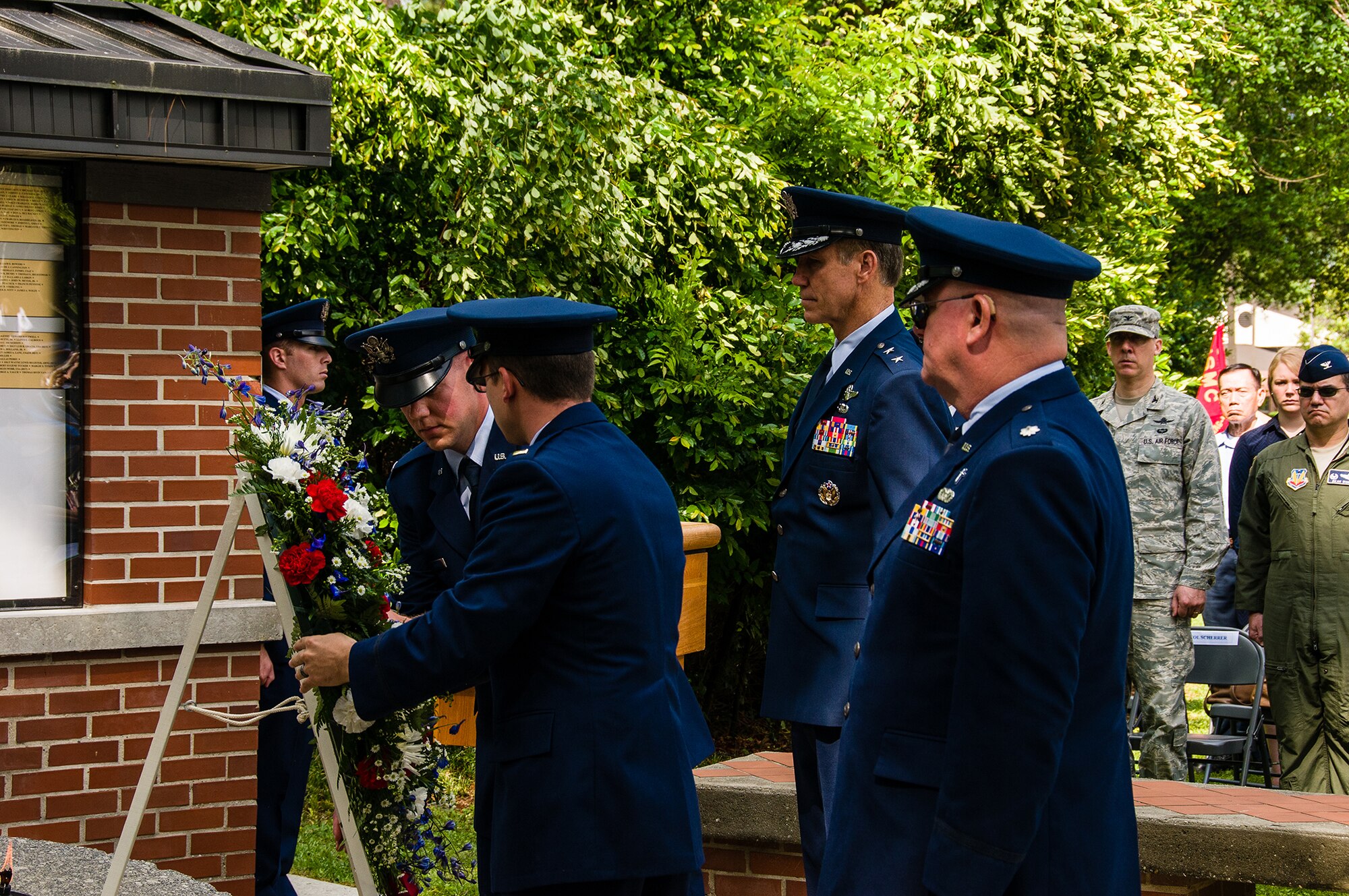 A wreath is placed at the memorial site May 23, 2013, on Robins Air Force Base, Ga. Members from Team Robins gathered at Camellia Garden Memorial for a service honoring those who served the Robins AFB community and are no longer with us. This year, 59 names were added to the memorial.(U.S. Air Force photo/Staff Sgt. Alexi Saltekoff)