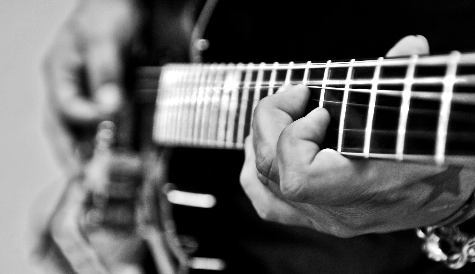Allen Steelgrave, musician, preforms for students at Ramstein Middle School on Ramstein Air Base, Germany, May 21, 2013. The Traveling Guitar Foundation embarked on its first USO tour of Germany. (U.S. Air Force photo/Airman 1st Class Jordan Castelan)