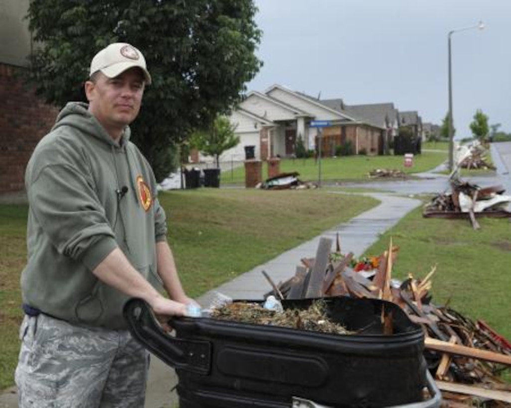 Army Master Sgt. Brian Hardee, a training noncommissioned Officer assigned to the 63rd Civil Support Team, Oklahoma National Guard, cleans up his yard after a deadly tornado struck Moore, Okla. U.S. Army photo by Sgt. 1st Class Kendall James
