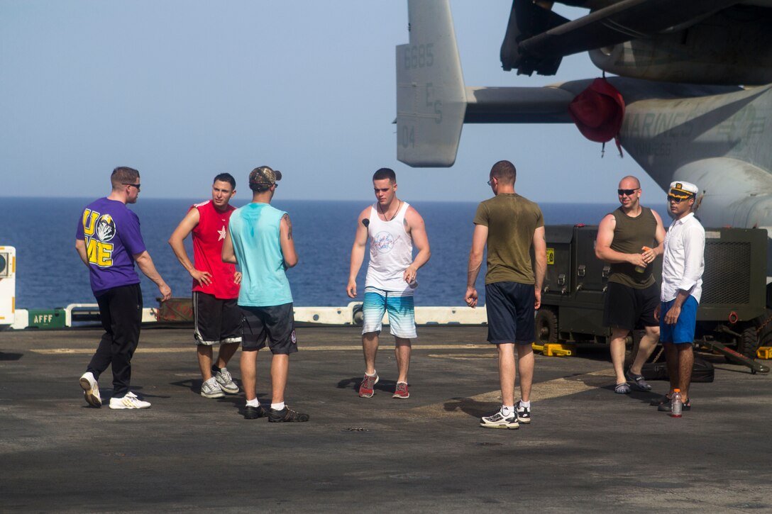 U.S. Marines assigned to the 26th Marine Expeditionary Unit (MEU), and U.S. Sailors assigned to the USS Kearsarge (LHD 3), play hackie sack during a Steel Beach Picnic on the flight deck of the USS Kearsarge at sea, May 25, 2013. The 26th MEU is deployed to the U.S. 5th and 6th Fleet areas of responsibility aboard the Kearsarge Amphibious Ready Group. The 26th MEU operates continuously across the globe, providing the president and unified combatant commanders with a forward-deployed, sea-based quick reaction force. The MEU is a Marine Air-Ground Task Force capable of conducting amphibious operations, crisis response and limited contingency operations. (U.S. Marine Corps photograph by Cpl. Kyle N. Runnels/Released)