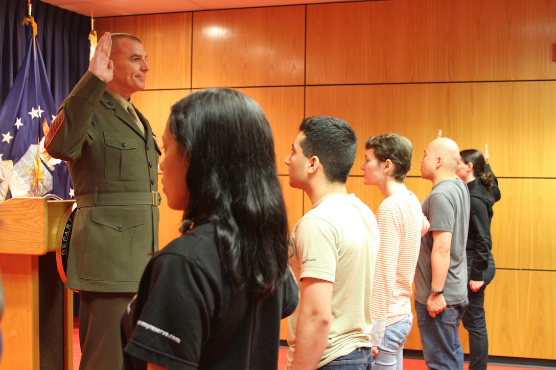Sgt. Maj. Bryan B. Battaglia, the Senior Enlisted Advisor to Chairman of the Joint Chiefs of Staff, administers the oath of enlistment to a group of applicants at the Military Entrance Processing Station at Fort Hamilton in Brooklyn, N.Y., May 21.  The oath of enlistment is one of the first steps for young men and women entering the military.