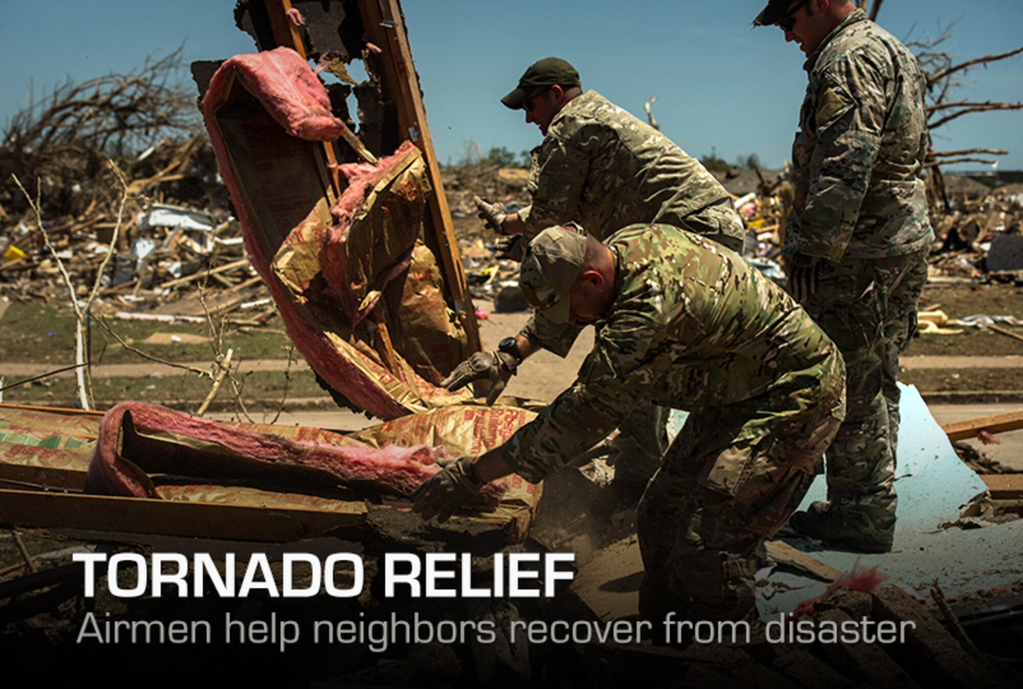 Airmen help a resident search through the debris looking for salvageable items May 22, 2013, in Moore, Okla.  An EF-5 tornado, with winds reaching at least 200 mph, traveled for 20 miles, leaving a two-mile-wide path of destruction, leveling homes, crushing vehicles, and killing more than 20 people May 20, 2013. More than 115 Oklahoma National Guard members have been activated to assist in the rescue and relief efforts.  (U.S. Air Force photo/Staff Sgt. Jonathan Snyder) 
