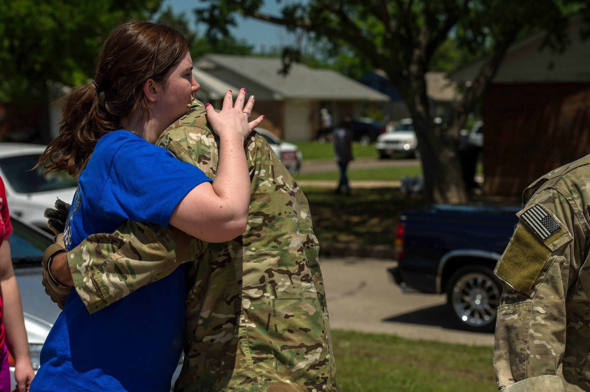 Alyson Tinney expresses her appreciation to Capt. Van Blaylock for helping her May 22, 2013, in Moore, Okla. An EF-5 tornado, with winds reaching at least 200 mph, traveled for 20 miles, leaving a two-mile-wide path of destruction, leveling homes, crushing vehicles, and killing more than 20 people May 20, 2013. More than 115 Oklahoma National Guard members have been activated to assist in the rescue and relief efforts. Blaylock is a joint terminal attack controller assigned to the 146th Air Support Operations Squadron. (U.S. Air Force photo/Staff Sgt. Jonathan Snyder) 