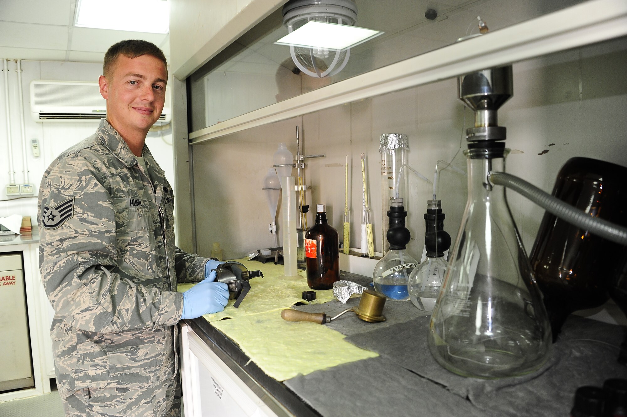 Staff Sgt. Andrew Hunn, Noncommissioned Officer In Charge of the 386th Expeditonary Logistics Readiness Squadron tests a fuel mixture in the fuels laboratory May 3. 