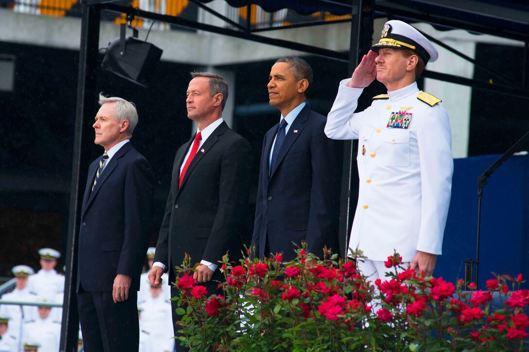 From right:  Vice Adm. Mike Miller, superintendent of the U.S. Naval Academy, President Barack Obama, Maryland Gov. Martin O' Malley, and Secretary of the Navy Ray Mabus come to attention during a 21-gun salute to render respect to the official party during the academy's Class of 2013 graduation and commissioning ceremony in Annapolis, Md., May 24, 2013.