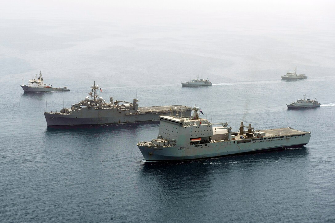 The Royal Fleet Auxiliary amphibious assault vessel Cardigan Bay and the Afloat Forward Staging Base USS Ponce lead a formation of ships participating in International Mine Countermeasures Exercise, May 9, 2013. The exercise includes navies from more than 40 countries whose focus is to promote regional security through mine countermeasure operations in the U.S. 5th Fleet area of responsibility.