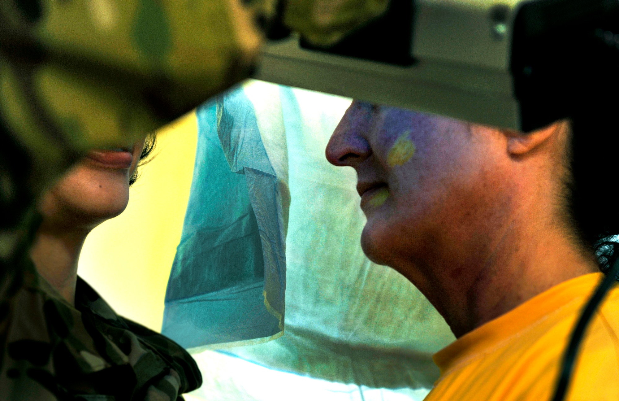 U.S. Army Capt. Sylvia Alvarado uses an ultraviolet light to detect foreign liquids on a simulated victim during Sexual Assault Forensic Examinations training on Bagram Airfield, Afghanistan, May 25, 2013. Alvarado is a flight surgeon and she will be returning to her base in Afghanistan to be one of two SAFE-qualified providers. (U.S. Air Force photo/Staff Sgt. Stephenie Wade)