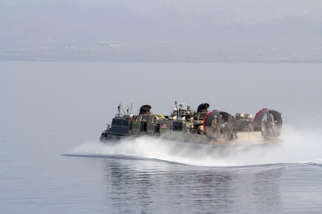 A landing craft, air cushion vessel assigned to the USS Kearsarge (LHD 3), transports light armored vehicles and Humvees assigned to the 26th Marine Expeditionary Unit (MEU), off the coast of Djibouti, May 27, 2013. The 26th MEU is a Marine Air-Ground Task Force forward-deployed to the U.S. 5th Fleet area of responsibility aboard the Kearsarge Amphibious Ready Group serving as a sea-based, expeditionary crisis response force capable of conducting amphibious operations across the full  range of military operations. (U.S. Marine Corps photograph by Cpl. Kyle N. Runnels/Released)