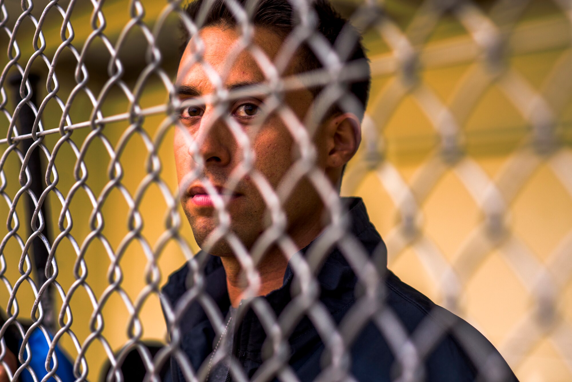 U.S. Air Force Senior Airman Cody Hyde, 18th Dental Squadron dental technician, watches baseball practice at Kadena Air Base, May 23, 2013. Hyde was invited to try out for the Armed Forces Baseball Team and will attend their training camp May 29-June 8 and, if selected, will travel around the United States playing baseball and interacting with the local communites across the country. (U.S. Air Force photo/Airman 1st Class Tyler Prince.) 