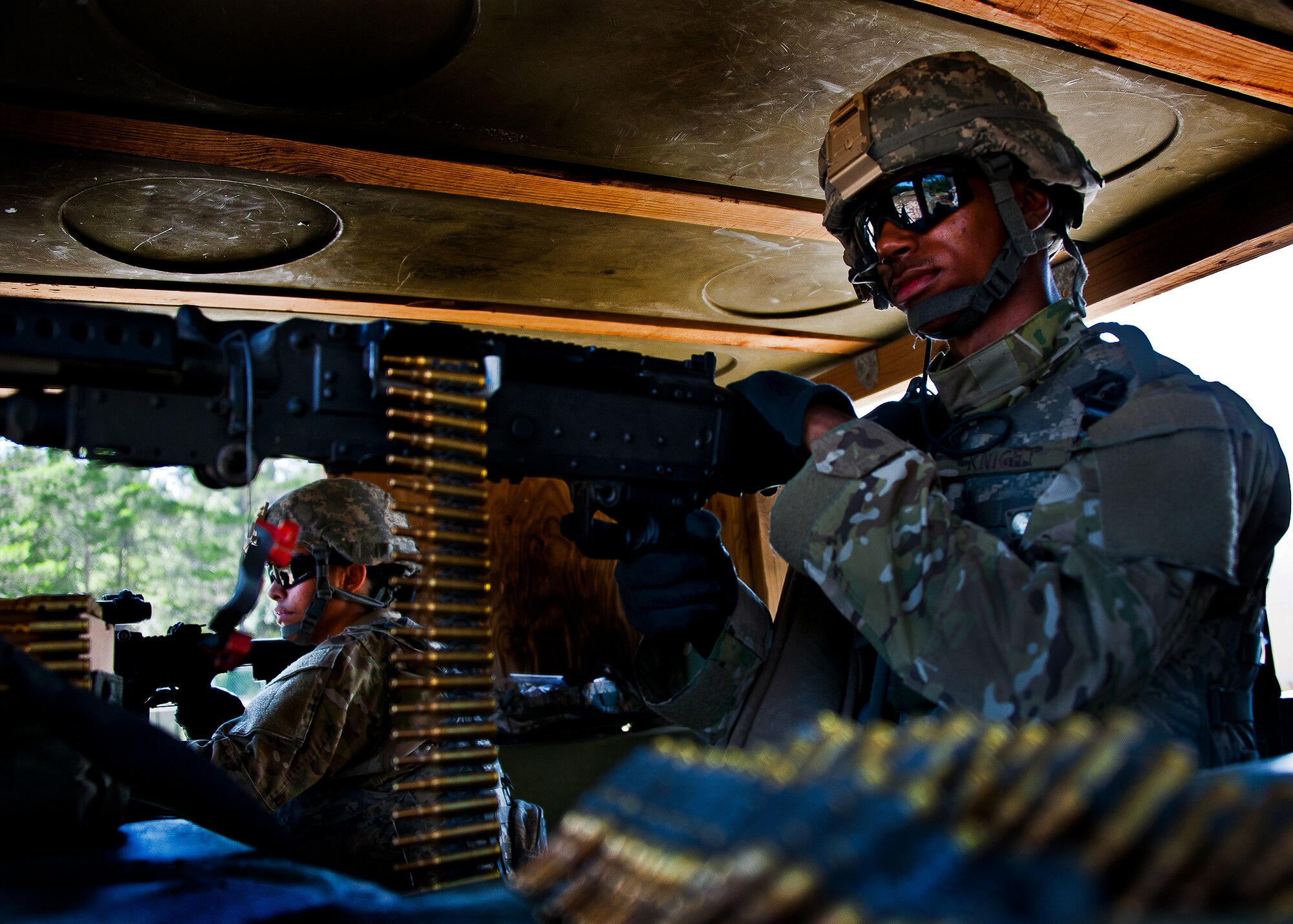 Airman 1st Class Derek Knight, of the 94th Security Forces Squadron, points his M-240 downrange while guarding his post along the wall of Base Tango during the three-day Brave Defender field training exercise May 20 at Eglin Air Force Base, Fla.  The exercise is the culmination of Air Force Materiel Command’s six-week security forces deployment training, administered by the 96th Ground Combat Training Squadron. GCTS instructors teach 10 training classes a year, which consists of improvised explosive device detection and reaction, operating in an urban environment, mission planning, land navigation and casualty care and more. More than 140 active-duty and National Guard Airmen attended this training. (U.S. Air Force photo/Samuel King Jr.)