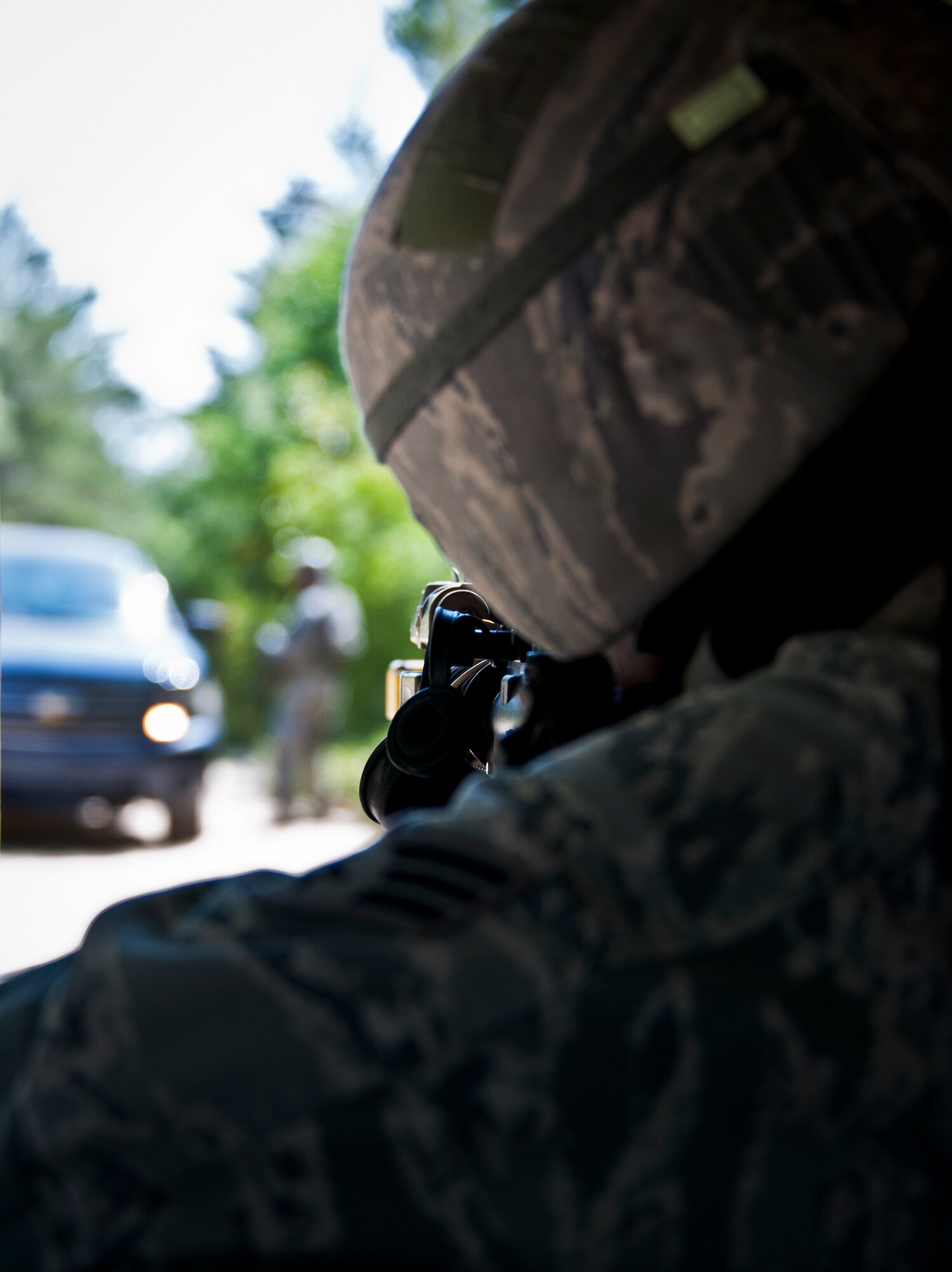 A Security Forces Airman fires his weapon from behind cover during an enemy assault on an entry control point at the three-day Brave Defender field training exercise May 19 at Eglin Air Force Base, Fla.  The exercise is the culmination of Air Force Materiel Command’s six-week security forces deployment training, administered by the 96th Ground Combat Training Squadron. GCTS instructors teach 10 training classes a year, which consists of improvised explosive device detection and reaction, operating in an urban environment, mission planning, land navigation and casualty care and more. More than 140 active-duty and National Guard Airmen attended this training. (U.S. Air Force photo/Samuel King Jr.)
