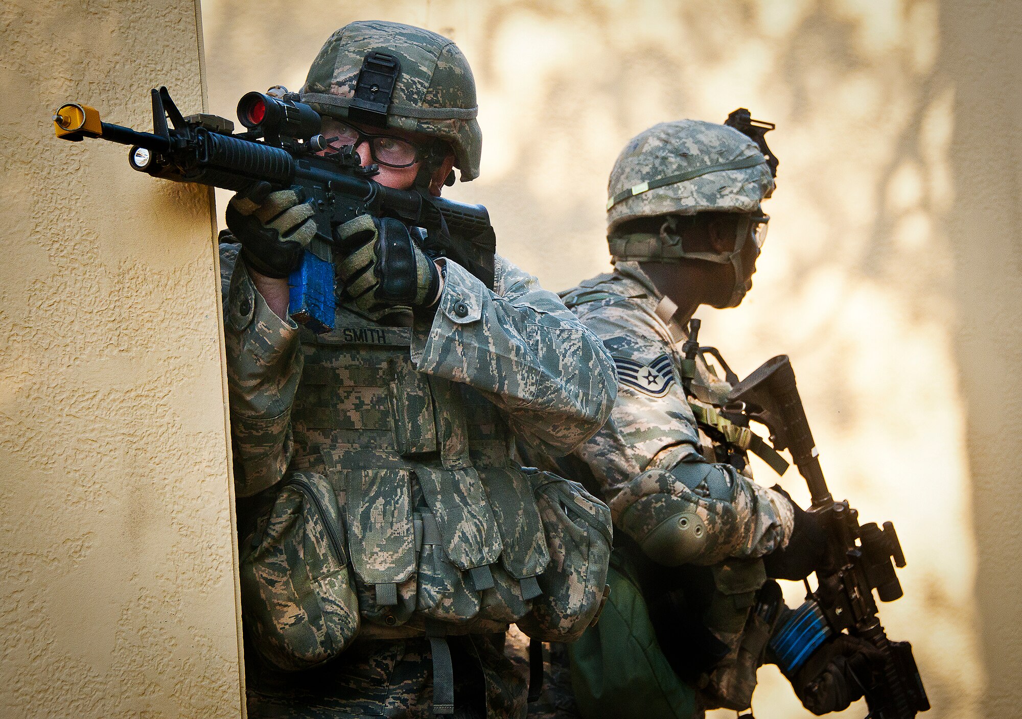 Airmen watch for enemy combatants during an assault on a village at the end of the three-day Brave Defender field training exercise May 20 at Eglin Air Force Base, Fla.  The exercise is the culmination of Air Force Materiel Command’s six-week security forces deployment training, administered by the 96th Ground Combat Training Squadron. GCTS instructors teach 10 training classes a year, which consists of improvised explosive device detection and reaction, operating in an urban environment, mission planning, land navigation and casualty care and more. More than 140 active-duty and National Guard Airmen attended this training. (U.S. Air Force photo/Samuel King Jr.)