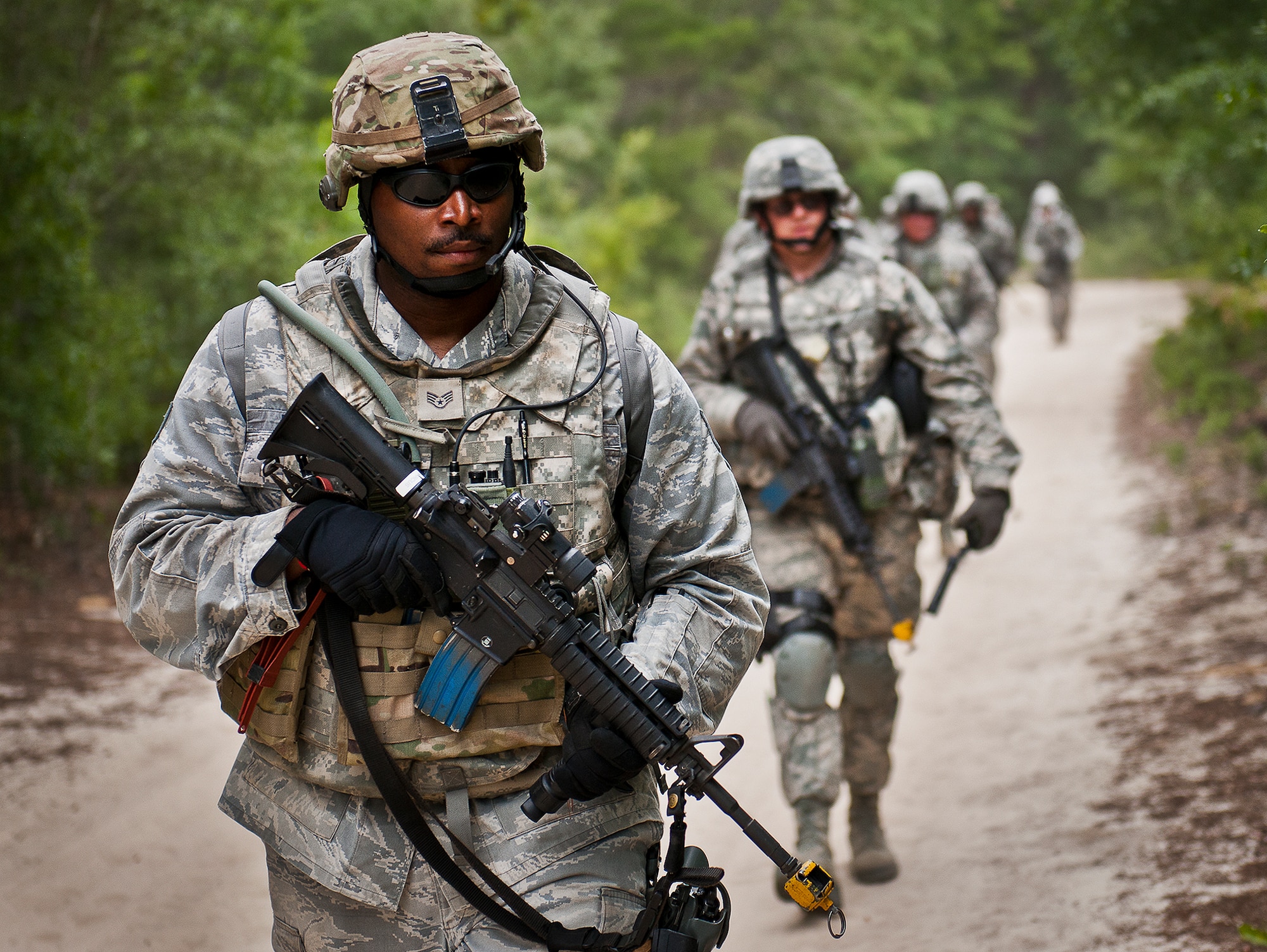 Staff Sgt. Marcus Dobbins, of the 164th Security Force Squadron, leads the way during a dismounted patrol as part of the three-day Brave Defender field training exercise May 19 at Eglin Air Force Base, Fla.  The exercise is the culmination of Air Force Materiel Command’s six-week security forces deployment training, administered by the 96th Ground Combat Training Squadron. GCTS instructors teach 10 training classes a year, which consists of improvised explosive device detection and reaction, operating in an urban environment, mission planning, land navigation and casualty care and more. More than 140 active-duty and National Guard Airmen attended this training. (U.S. Air Force photo/Samuel King Jr.)
