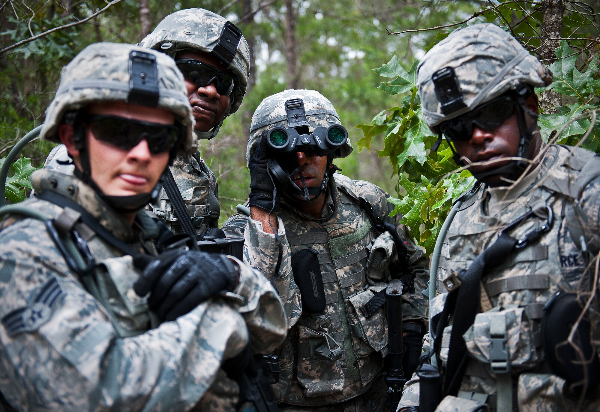 Senior Airman William Whitlow, of the 164th Security Forces Squadron, and his fire-team check out a possible weapons cache during a dismounted patrol as part of the three-day Brave Defender field training exercise May 19 at Eglin Air Force Base, Fla.  The exercise is the culmination of Air Force Materiel Command’s six-week security forces deployment training, administered by the 96th Ground Combat Training Squadron. GCTS instructors teach 10 training classes a year, which consists of improvised explosive device detection and reaction, operating in an urban environment, mission planning, land navigation and casualty care and more. More than 140 active-duty and National Guard Airmen attended this training. (U.S. Air Force photo/Samuel King Jr.)