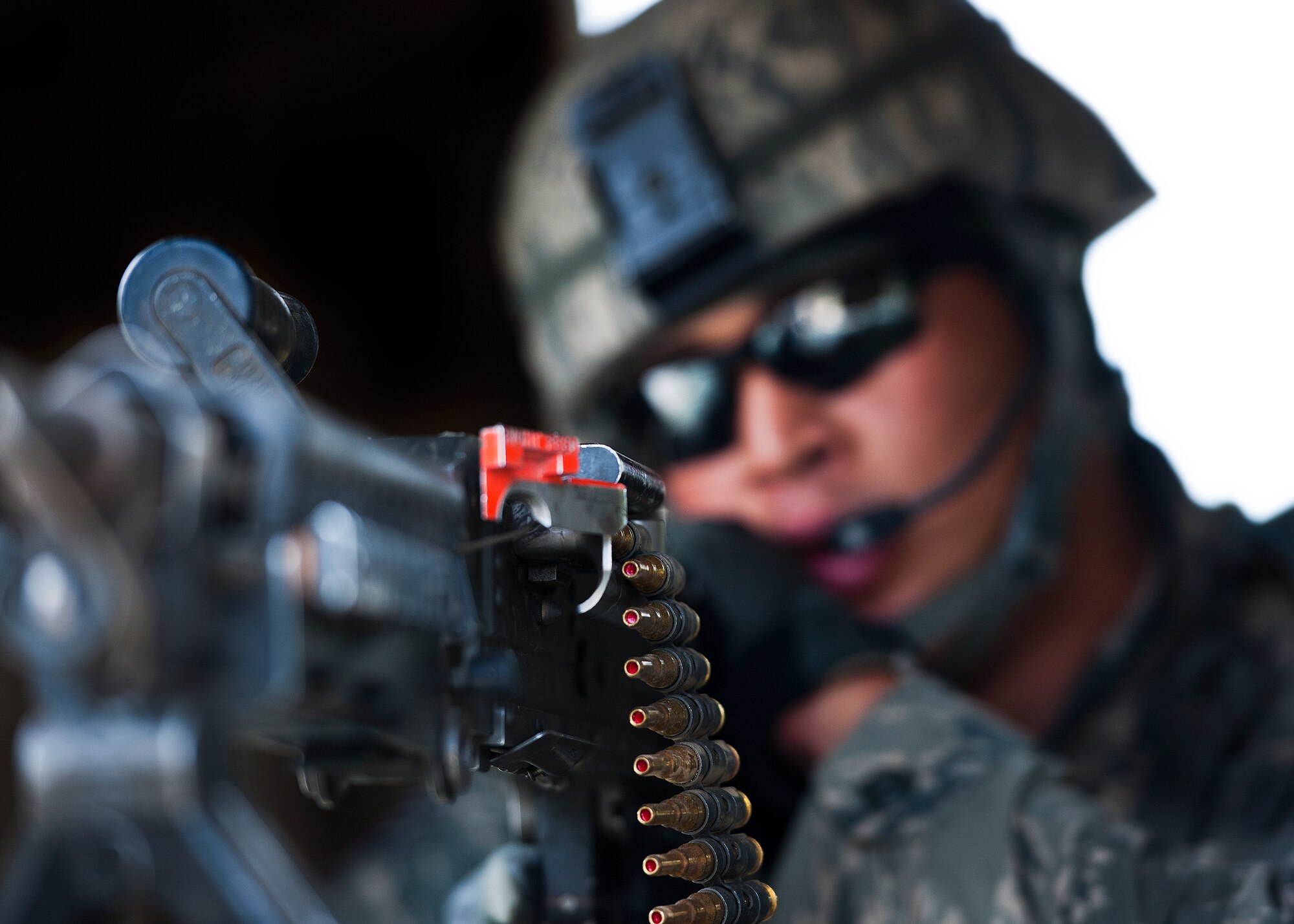 Staff Sgt. Nathan Craven, of the 30th Security Forces Squadron, points his M-249 downrange while guarding a post at Base Tango’s entry control point during the three-day Brave Defender field training exercise May 19 at Eglin Air Force Base, Fla.  The exercise is the culmination of Air Force Materiel Command’s six-week security forces deployment training, administered by the 96th Ground Combat Training Squadron. GCTS instructors teach 10 training classes a year, which consists of improvised explosive device detection and reaction, operating in an urban environment, mission planning, land navigation and casualty care and more. More than 140 active-duty and National Guard Airmen attended this training. (U.S. Air Force photo/Samuel King Jr.)