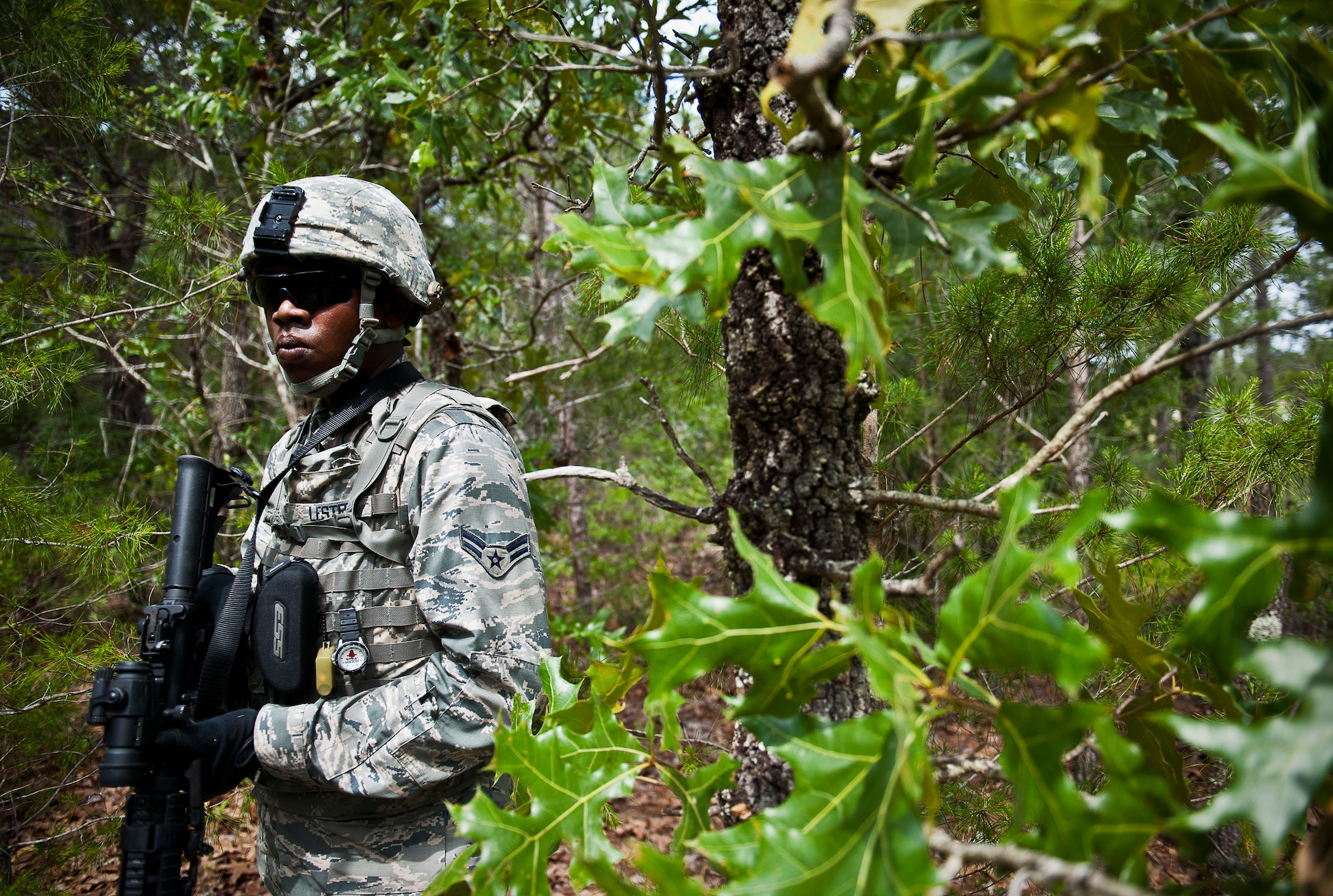 Airman 1st Class Archie Lester, of the 164th Security Forces Squadron, moves through the forest during a dismounted patrol as part of the three-day Brave Defender field training exercise May 19 at Eglin Air Force Base, Fla.  The exercise is the culmination of Air Force Materiel Command’s six-week security forces deployment training, administered by the 96th Ground Combat Training Squadron. GCTS instructors teach 10 training classes a year, which consists of improvised explosive device detection and reaction, operating in an urban environment, mission planning, land navigation and casualty care and more. More than 140 active-duty and National Guard Airmen attended this training. (U.S. Air Force photo/Samuel King Jr.)