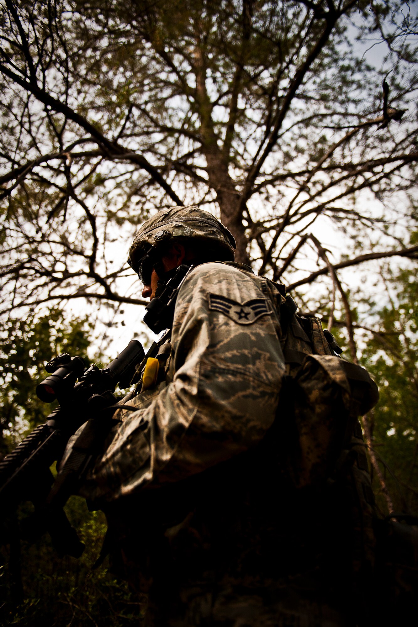 Senior Airman Ian Barnes, of the 164th Security Forces Squadron, moves through the forest during a dismounted patrol as part of the three-day Brave Defender field training exercise May 19 at Eglin Air Force Base, Fla.  The exercise is the culmination of Air Force Materiel Command’s six-week security forces deployment training, administered by the 96th Ground Combat Training Squadron. GCTS instructors teach 10 training classes a year, which consists of improvised explosive device detection and reaction, operating in an urban environment, mission planning, land navigation and casualty care and more. More than 140 active-duty and National Guard Airmen attended this training. (U.S. Air Force photo/Samuel King Jr.)