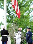 Members of the United States Transportation Command Joint Honor Guard raise the American flag to the playing of reveille during a Memorial Day Remembrance event held at the 375th Air Mobility Wing headquarters building May 27, 2013. The name "Memorial Day" was first used in 1882 and was not declared the official name by Federal law until 1967. (U.S. Air Force photo/Staff Sgt. Teresa M. Jennings)