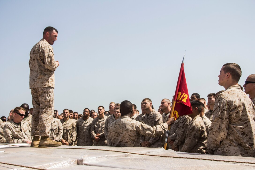 Capt. Raymond Kaster, USS Carter Hall (LSD 50) commander of troops and Company K commanding officer, Battalion Landing Team 3/2, 26th Marine Expeditionary Unit (MEU), speaks to the 26th MEU Marines and Sailors aboard the USS Carter Hall about the significance of Memorial Day, while at sea, May 27, 2013. The 26th MEU is a Marine Air-Ground Task Force forward-deployed to the U.S. 5th Fleet area of responsibility aboard the Kearsarge Amphibious Ready Group serving as a sea-based, expeditionary crisis response force capable of conducting amphibious operations across the full range of military operations.
(U.S. Marine Corps photo by Cpl. Michael S. Lockett/Released)
