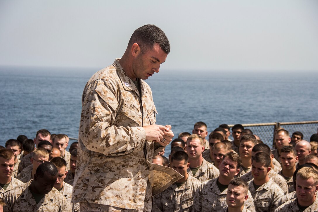 Capt. Raymond Kaster, USS Carter Hall (LSD 50) commander of troops and Company K commanding officer, Battalion Landing Team 3/2, 26th Marine Expeditionary Unit (MEU), speaks to the 26th MEU Marines and Sailors aboard the USS Carter Hall about the significance of Memorial Day, while at sea, May 27, 2013. The 26th MEU is a Marine Air-Ground Task Force forward-deployed to the U.S. 5th Fleet area of responsibility aboard the Kearsarge Amphibious Ready Group serving as a sea-based, expeditionary crisis response force capable of conducting amphibious operations across the full range of military operations.
(U.S. Marine Corps photo by Cpl. Michael S. Lockett/Released)

