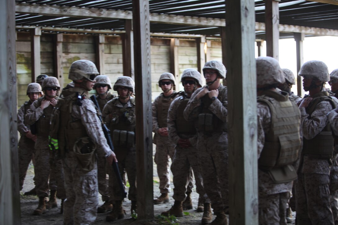 Marines attached to Combat Logistics Battalion 6, 2nd Marine Logistics Group receive a safety briefing before firing M-1014 Joint Service Combat Shotguns during a shotgun qualification aboard Camp Lejeune, N.C., May 22, 2013. The Marines are scheduled to deploy to Afghanistan, where they will use the M-1014s to guard ammunition with a low risk of causing collateral damage to the munitions. 