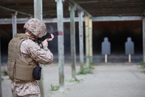 A Marine attached to Combat Logistics Battalion 6, 2nd Marine Logistics Group fires an M-1014 Joint Service Combat Shotgun during a shotgun qualification aboard Camp Lejeune, N.C., May 22, 2013. The Marines trained with shotguns in preparation for guarding an ammunition supply point during an upcoming deployment.