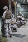 Service members attached to Combat Logistics Battalion 6, 2nd Marine Logistics Group set up fresh targets after training with M-1014 Joint Service Combat Shotguns during a shotgun qualification aboard Camp Lejeune, N.C., May 22, 2013. Each Marine practiced loading and firing procedures in order to prepare for ammunition guard duty during an upcoming deployment.