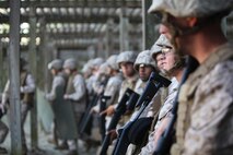 Marines attached to Combat Logistics Battalion 6, 2nd Marine Logistics Group wait for the range to clear before firing M-1014 Joint Service Combat Shotguns during a shotgun qualification aboard Camp Lejeune, N.C., May 22, 2013. The Marines followed strict guidelines, which included wearing body armor and remaining aware of their surroundings on the range to keep themselves and fellow service members safe.