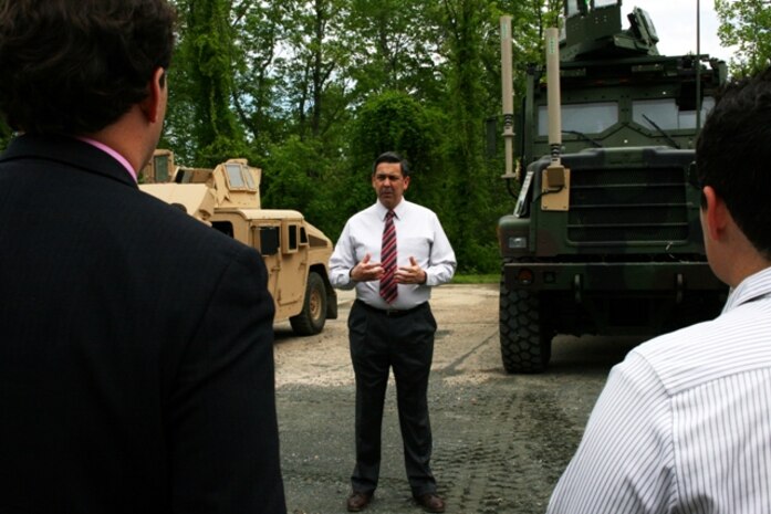 Ruben Garza, Transportation Demonstration Support Area manager,  a TDSA overview briefing to members of the Small Business Administration and Marines participating in the “Boots to Business” program during a visit May 9 in Quantico, Va. The group visited TDSA to view static displays of several Marine Corps vehicle platforms.