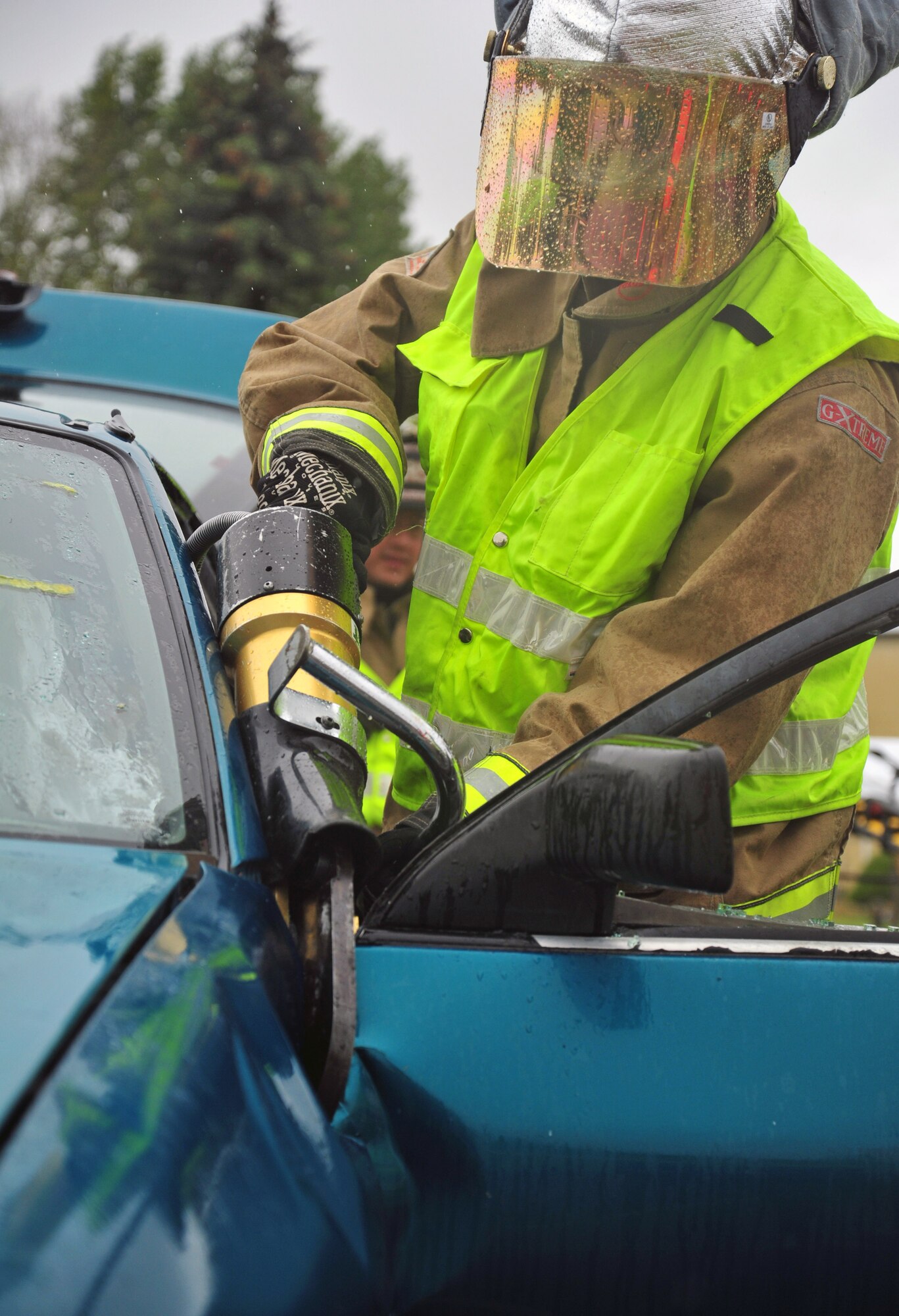 92nd Civil Engineer Squadron firefighters use the “Jaws of Life” to tear open a vehicle and extract a simulated victim of a car crash during a demonstration at Fairchild Air Force Base, Wash., May 22, 2013. Jaws of Life are hydraulic rescue tools used by emergency rescue personnel to assist extraction of automobile accident victims. (U.S. Air Force photo by Senior Airman Taylor Curry/Released)