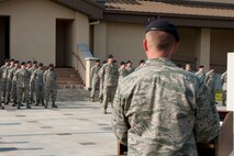 Lt. Col. Nathan Schalles, 8th Security Forces Squadron commander, gives a speech during a memorial retreat at Kunsan Air Base, Republic of Korea, May 15, 2013. 8th SFS members stood in formation while the names of members who died in the line of duty were read and the flag was lowered. (U.S. Air Force photo by Staff Sgt. Jonathan Fowler/Released)