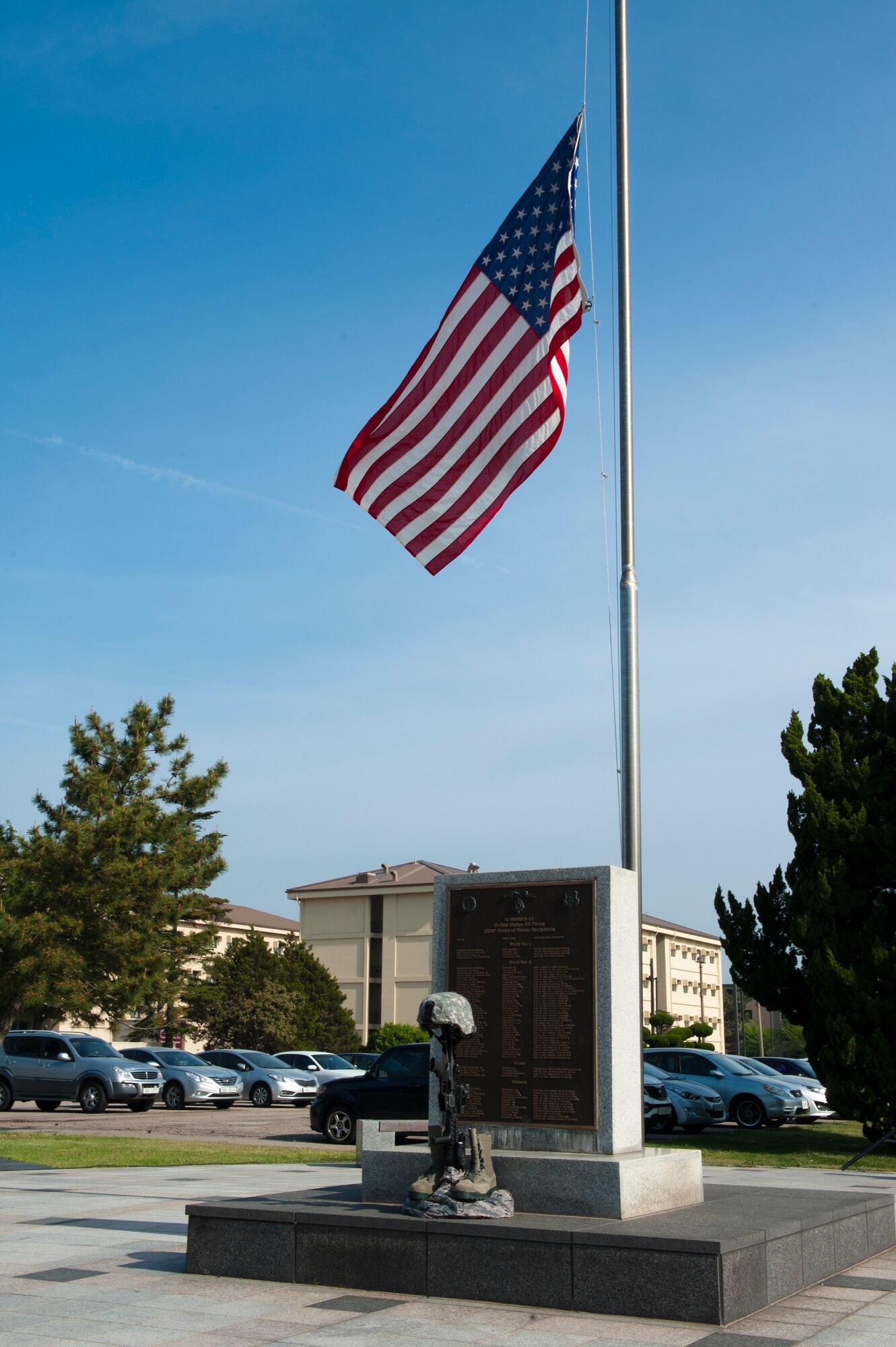 The U.S. Flag sits at half- staff before a National Police Week memorial retreat at Kunsan Air Base, Republic of Korea, May 15, 2013. The retreat was in honor of security personnel who have fallen in the line of duty. (U.S. Air Force photo by Staff Sgt. Jonathan Fowler/Released)
