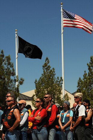 Attendees watch the wreath laying ceremony during the Special Forces Memorial at the Southern Nevada Veterans Memorial Cemetery, Boulder City, Nev., May 26, 2013. The event was held to honor Special Forces members from all wars who lost their lives defending their country. (U.S. Air Force photo by Tech. Sgt. Taylor Worley)