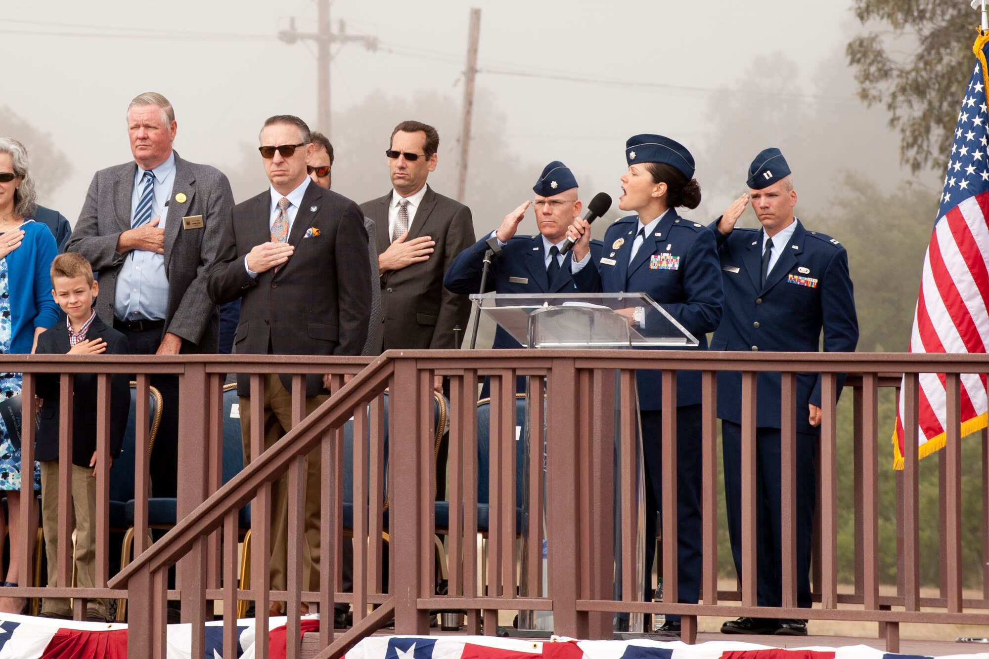 VANDENBERG AIR FORCE BASE, Calif. – Lt. Col. Mary Garbowski, 30th Medical Support Squadron commander, sings the national anthem during a change-of-command here Tuesday, May 28, 2013. Col. Keith Balts, 30th Space Wing commander, took command from Col. Nina Armagno, 30th SW former commander, whose next stop is Patrick AFB, Fla., to take command of the 45th Space Wing.  (U.S. Air Force photo/Airman Yvonne Morales)