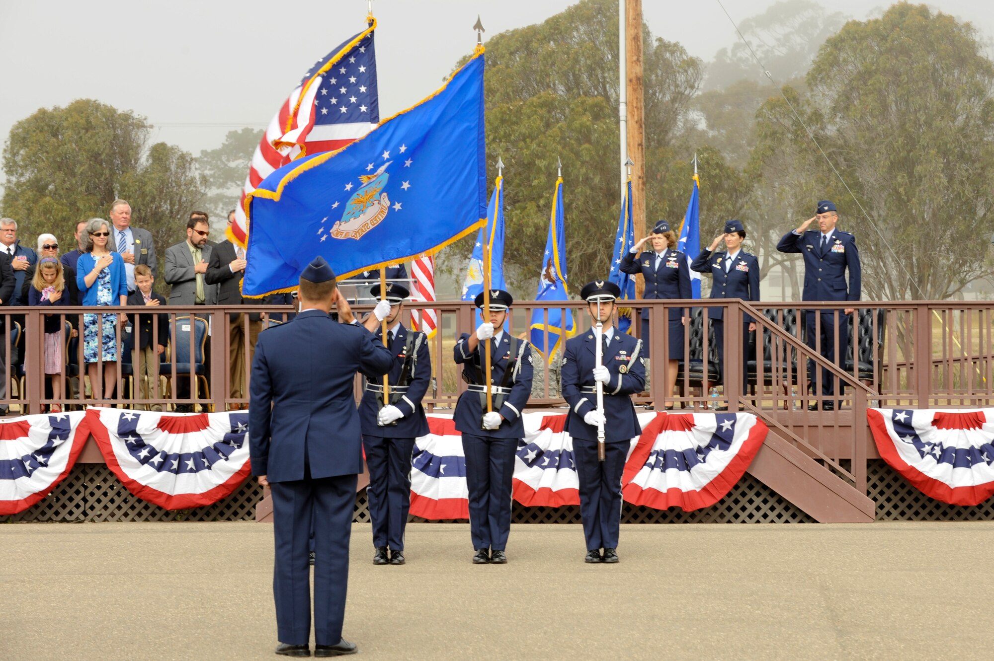 VANDENBERG AIR FORCE BASE, Calif. – The official party salutes the United States flag during a 30th Space Wing change-of-command at the parade grounds here Tuesday, May 28, 2013. Col. Keith Balts took command of the 30th SW at the ceremony from the former 30th SW commander, Col. Nina Armagno. (U.S. Air Force photo/Senior Airman Lael Huss)