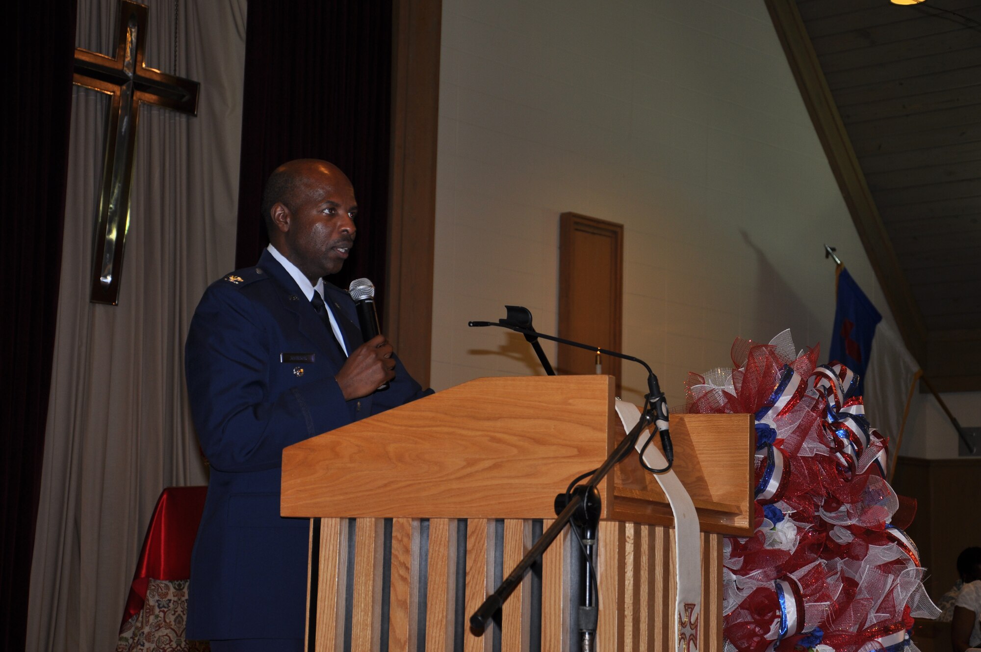 Col. Malcolm T. Johnson, 2nd Air Force vice commander, speaks about Memorial Day at the 11 a.m. gospel service at Larcher Chapel on May 26, 2013.The special service was held for members of the congregation to honor lost loved ones with the lighting of candles and community support. (U.S. Air Force photo by Airman 1st Class Stephan Coleman)