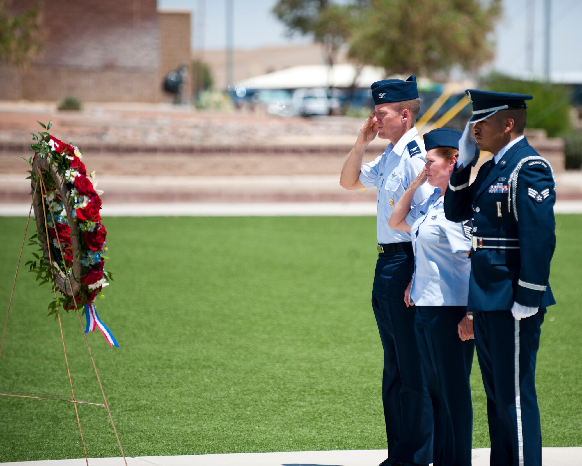 Col. Kenneth Ekman, 49th Wing vice commander, and Chief Master Sgt. Wendy Rowe, 49th Materiel Maintenance Squadron superintendent, salute a memorial wreath during a Memorial Day ceremony at Holloman Air Force Base, N.M., May 22. Memorial Day is a day of remembering the men and women who died while serving in the United States Armed Forces. Formerly known as Decoration Day, it originated after the American Civil War to commemorate the Union and Confederate soldiers who died in the Civil War. (U.S. Air Force photo by Airman 1st Class Daniel E. Liddicoet/Released)