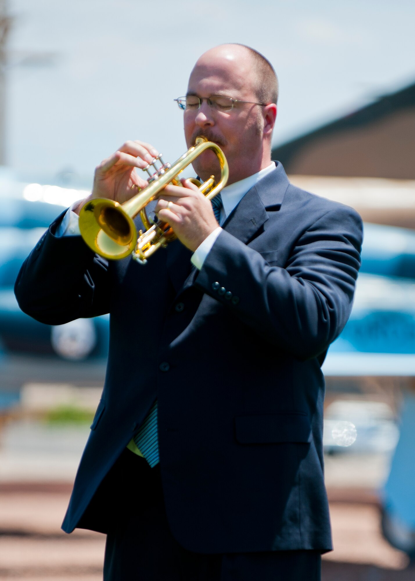 A musician plays the song Taps during a Memorial Day ceremony at Holloman Air Force Base, N.M., May 22. Memorial Day is a day of remembering the men and women who died while serving in the United States Armed Forces. Formerly known as Decoration Day, it originated after the American Civil War to commemorate the Union and Confederate soldiers who died in the Civil War. (U.S. Air Force photo by Airman 1st Class Daniel E. Liddicoet/Released)